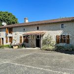 Gorgeous stone house with outbuildings + land