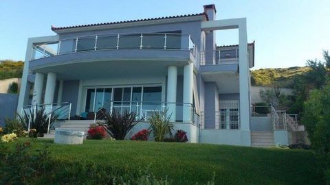 Mourteris Beach Evia For sale a villa of 270 sq.m. modern, contemporary and fully furnished (two-storey house 173sq.m with garage 52sq.m with independent guest house 30sq.m and 15sq.m auxiliary space) built on a plot of 1,500sq.m just 80m. from the s...