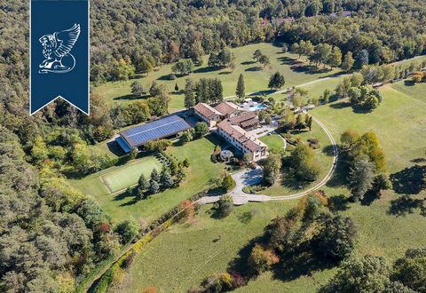This exclusive luxury estate is currently up for sale in a high-end context of the marvelous leafy area surrounding Como and Varese. The main villa encompasses four floors: the ground floor hosts a living area with a big hall, a dining room, a utilit...