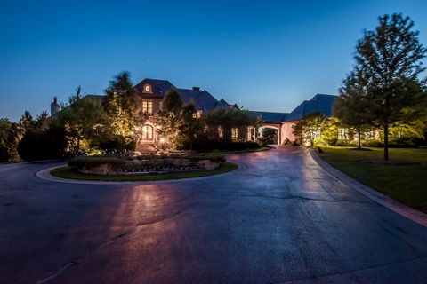 This stunning one of a kind estate is located in Barrington Hills on 12.3 beautiful acres. The house boasts expert craftsmanship and the finest materials, resulting in a true masterpiece. As you enter the property, you are greeted with an exquisite t...