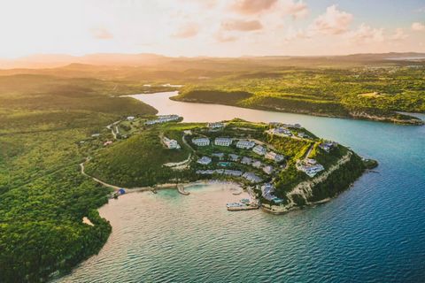 Located in Nonsuch Bay Resort, a four star gated community ideally situated on a hillside peninsula surrounded by greenery and water on three sides, a spacious two bedroom, two bathroom home with panoramic ocean views is available for sale. Every roo...