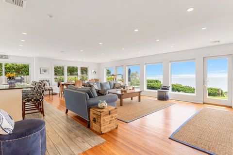 Experience the epitome of coastal luxury with this stunning 4-bedroom home, perched high on a bluff along Oceanview Drive, offering direct southern exposure and breathtaking views of Shinnecock Bay. This rare gem, located south of the highway, featur...