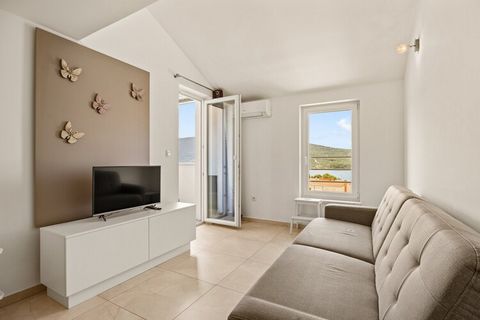 This modern and beautifully decorated apartment offers an ideal getaway for families, accommodating up to 4 adults. It features two spacious bedrooms, each with a king-size bed, a cozy living room, a fully equipped kitchen, and a bathroom. The apartm...