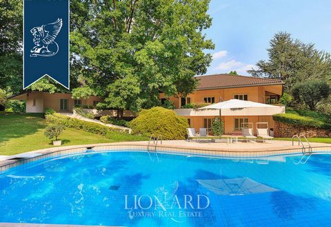 This wonderful modern villa with an outbuilding is for sale in a 7-hectare park with a stunning outdoor swimming pool, a tennis court and a bocce field, in the leafy Brianza area, just 30 km from Milan. Its lush seven-hectare park offers a pleasant a...