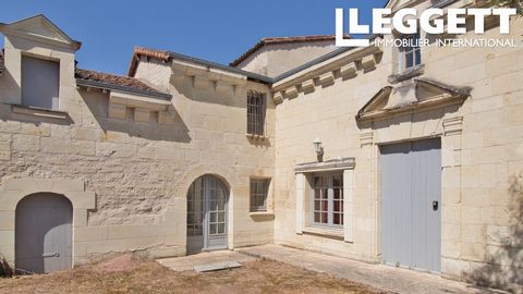 A13056 - Located in the south Loire Valley, this property is hidden at the end of a cul-de-sac. A gate gives access to a courtyard and reveals a beautiful stone front. Situated in the heart of a town of art and history, Loudun, this charming property...