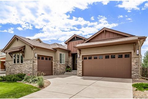 Experience Colorado living at its finest! Work from home or unwind on the main floor deck, then head to the finished walkout basement for a drink at the wet bar and enjoy breathtaking Rocky Mountain sunsets. With open space backing and a Denver skyli...