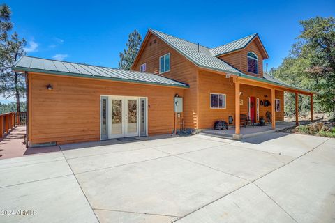 Enjoy the cool mountain breeze while sitting on the deck of this large 3,635SF, 4 bed, 3 bath home. Upgraded and elegant. Views for miles. Located in the forest, on 2 acres in the Upper Big Bug area, with direct access from Big Bug Mesa Road with a k...