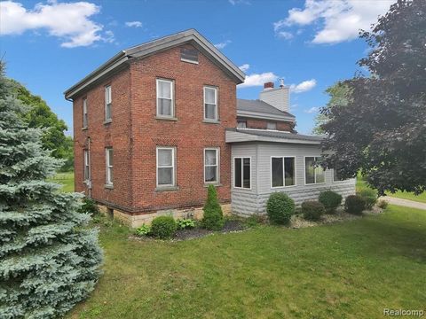 A great opportunity for a primary residence or future development potential! Old farmhouse exudes warmth and features a 2 car garage with a lean-to. This home features a large family room with stone fireplace, formal living room, a wrap-around four s...