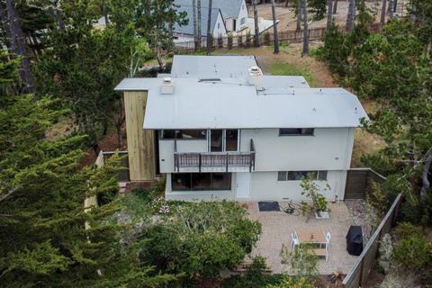 Perched on an expansive, tree studded lot overlooking the 17 Mile drive with incredible Ocean and Point Lobos views, this 4 bedroom, 3 bath home has a contemporary mid-century vibe. The spacious 2330 square foot residence has been upgraded by the cur...