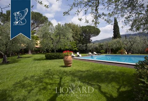 On the hills between Lucca and Pistoia, in Tuscany, this house for sale is surrounded by splendid vineyards and olive groves, entirely fenced, and includes six parking spaces. The estate houses a large park of five hectares with ancient curbs and san...