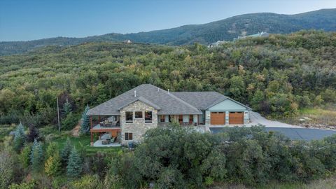 Featuring spectacular, panoramic scenery; numerous patios and decks; and top-quality finishes; this one-of-a-kind home is a dream come true! Enjoy 360-degree views of Ogden Valley-including mountains, pastures, forest, and lake-from large windows, yo...