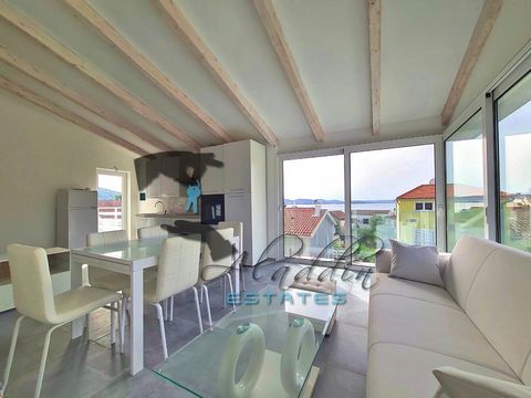 Three apartments in a three-story building in new construction in Bilice near Šibenik, one apartment on each floor. Apartment on the ground floor has 61.89 m2 of internal space, 115.97 m2 of the surrounding garden and a parking slot. In total, it tot...