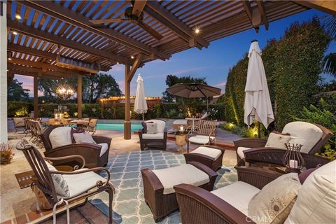 Spectacular premium and private entertainer’s home situated on an expansive lot in the lakeside community of Andalusia, within the heart of Lake Mission Viejo. This home was designed to entertain and delight in the European inspired, dream backyard t...
