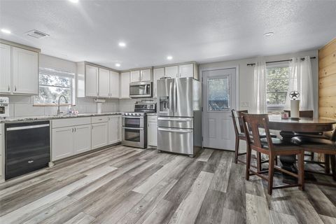 Welcome to your dream lake house in the charming Cambridge Shores community! This stunning two-story home is perfectly positioned on a peaceful cul-de-sac lot. The expansive open-concept design seamlessly connects the kitchen and living areas on both...