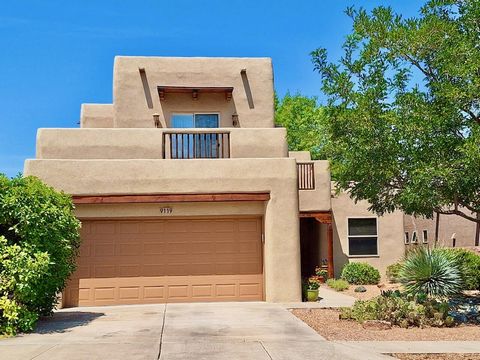 Custom Gallipoli home with charming southwestern touches, including a kiva-style fireplace with Banco, tongue & groove pine ceilings, vigas, corbels, & copper-trimmed beams. Open floor plan features tall ceilings, tons of natural light & sunset views...