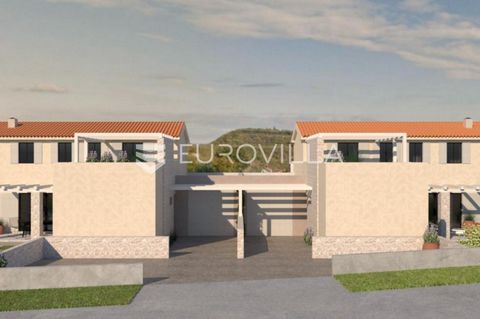 A modern semi-detached house is for sale, located in a village near Momjan, 12 km from the sea and 5 km from Buje. The ground floor consists of an entrance hall, a kitchen, a dining room and an open living room with access to a covered terrace and ya...