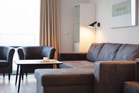 Modern and comfortable apartment with a view of the Baltic Sea and the marina. Enjoy the beautiful panoramic view of the Baltic Sea from morning to night. The modern and comfortably furnished apartment consists of an open kitchen-living area with din...