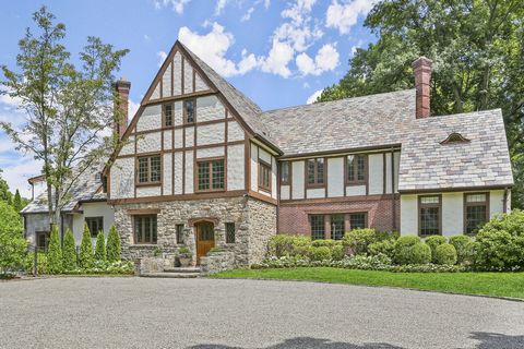 Extraordinary six-bedroom stone/stucco English Manor graces 1.55 manicured acres with secluded pool, stone terraces, pond and fountain in private association five minutes from town center. Thoughtfully renovated and expanded 1928 home boasts stunning...