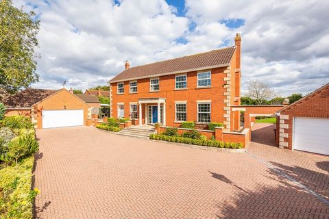 The flexible and versatile living space is set over two floors and sees welcoming reception rooms, a stunning living kitchen along with five double bedrooms and three bathrooms.   Externally there are generous and well-maintained grounds of around 0....