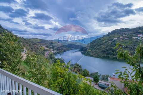 VILLA WITH VIEW OVER THE DOURO RIVER   House T3 inserted in a plot of land with 3.047m2 in the middle of the Douro region. Consisting of 3 bedrooms, living and dining room, furnished and equipped kitchen, in the basement we find a garage, with laundr...