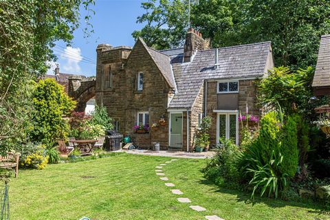 Packed with character, this delightful lodge has an entrance hall, bespoke fitted kitchen, cosy sitting room, atmospheric dining room, a staircase set within a turret (yes!), two double bedrooms and a bathroom.  Within the stunning private garden is ...