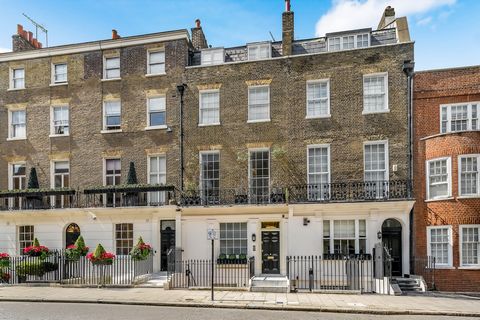 This exceptionally well presented family home boasts an abundance of wonderful features and unfolds over five floors. The ground floor comprises a study, a dining room and a guest W.C. On the lower ground floor you will find the sleek and modern full...