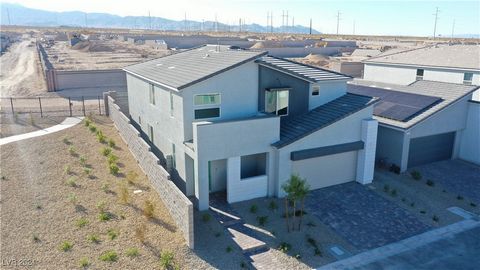 Brand New KB Home in the Northwest Gated Neighborhood of Talus / Great Location just north of Skye Canyon off Kyle Canyon road with Beautiful Views towards the Mountains / Over 3000 SF Home with 1 Bedroom and Full Bathroom downstairs and 4 bedrooms a...