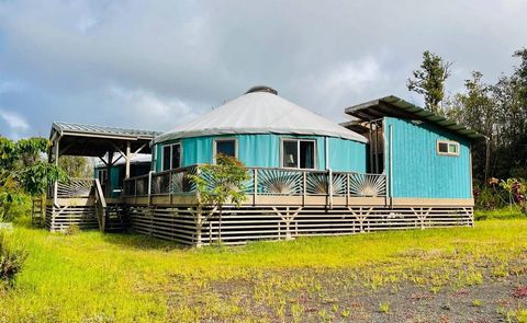 Live completely off-grid and enjoy total self-sufficiency on this 6.8-acre property with two spacious yurts, connected by an extra-large covered lanai. Each yurt has approximately 704 square feet of living space, brightened by multiple windows and a ...