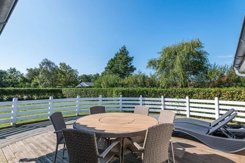 On lovely grounds with lots of opportunities for play and with a beautiful terrace surrounded by a small wooden fence, we have here a really cozy holiday home. Living room and kitchen are in open connection with each other, with the stove as a comple...