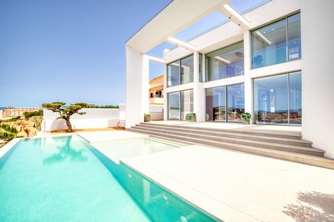 The villa is located on an 890m2 plot and overlooks the port of Port Adriano. On an area of 615m2 this unique property offers a total of 4 bedrooms and 4 bathrooms. Furthermore, the villa has an open plan living and dining area with a modern open kit...