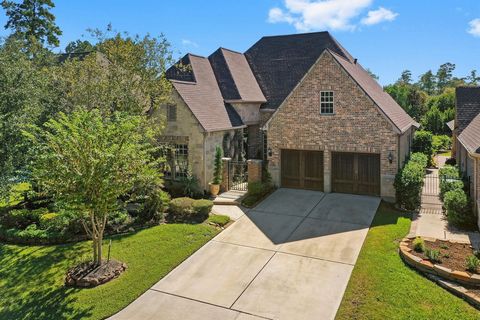 Beautiful Darling home with fantastic upgrades including hand-scraped wood floors (no carpet in home), brick arched entry into Sunroom, plantation shutters, salt-water pool with waterfalls, covered porch with brick fireplace, and outdoor kitchen w/gr...