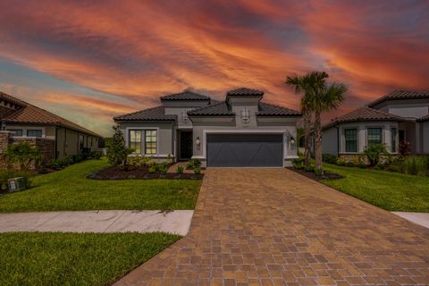 Experience the epitome of resort-style living in this stunning, newly constructed Taylor Morrison home. Located within the gated Esplanade community of Starkey Ranch, this exquisite Lazio model home boasts premium finishes and unparalleled structural...