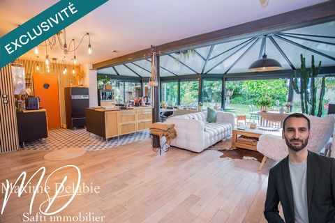 Maison d'architecte à Trangé avec garage attenant : élégance et nature en harmonie