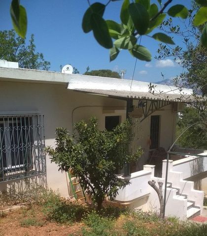 Glyka Nera, Plagia Ymittou. For sale a  detached house of 92 sq.m., semi-basement – elevated ground floor – 1st, 2 bedrooms, bathroom, on a plot of 295 sq.m., suitable for commercial use, renovated, 15 km from the center of Athens, within the city pl...