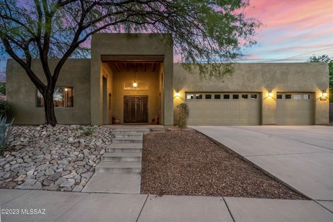 Just minutes from the UofA & Downtown Tucson, this 4 bedroom 3 bathroom home bordering natural desert offers so much for you to enjoy! Natural light, custom kitchen, fabulous floorplan, pool, solar power, 3 car garage - all on just over a 1/3 of an a...
