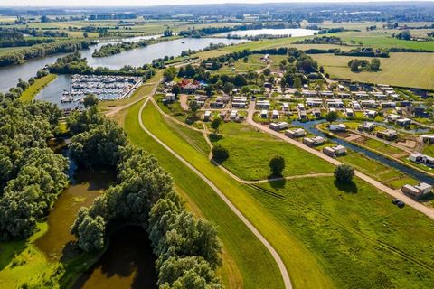 This detached tiny house is located in the recently opened holiday park Marina Strandbad, 1.7 km from the small town of Olburgen. Marina Strandbad is located on the banks of Het Zwarte Schaar, almost directly on the river IJssel, 20 km southwest of t...