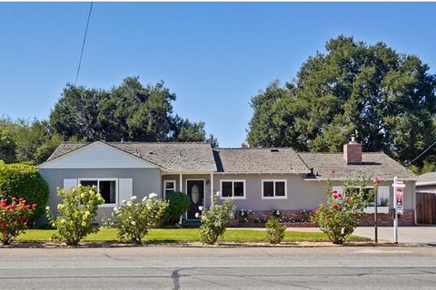 Updated and expanded close to Rancho Shopping Center! Living room and dining room combination with wood-burning fireplace and double French doors to the sunroom. Inviting sunroom with access to living and family room, carpeted floor, two skylights, w...