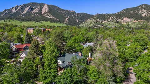 Welcome to one of Boulder's finest neighborhoods in lower Chautauqua. Tree-lined streets filled with picturesque turn of the century homes. A beautiful Craftsman sits amongst the trees on this absolutely gorgeous & private corner lot (12,873 sqft). T...