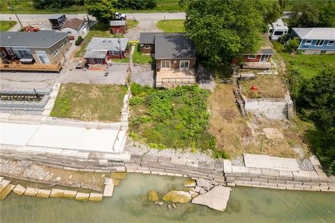 Lake Erie Waterfront Living! Exquisitely updated 2 bedroom, 1 bathroom Lake Erie dream Cottage with Incredible views offering direct 50’ x 135’ waterfront lot on sought after South Coast Drive. Great curb appeal with vinyl sided exterior, steel roof,...