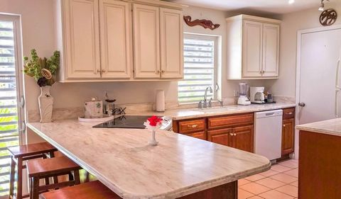 Nestled in the midst of the beloved Ocean Club Resort is this very well priced second floor 2 bedroom condo suite 8203. With 1,638 square feet of living space, the condo offers plenty of room to enjoy the relaxed island lifestyle. The property is alr...