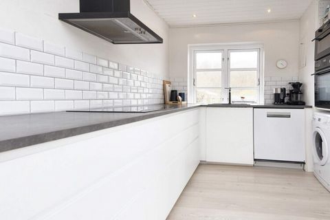 A holiday cottage with tiled floors, pitched roof and a smart arrangement with facilities like a heat pump, dish washer, etc. The house is in walking distance from the beach and the forest of Munkebjergskoven. Located in an enclosed cottage area with...