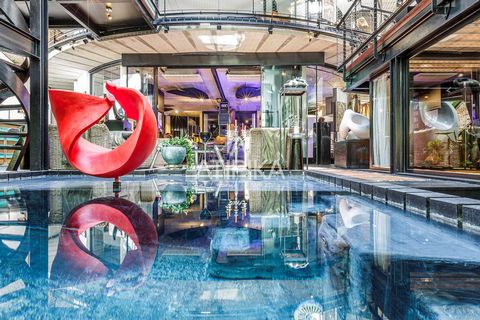 Art, Architecture, and Private Living in a Contemporary Style A unique architectural masterpiece for sale located in the vibrant and creative neighborhood of Poblenou, just steps from the sea. This exceptional property combines art, modern design, an...