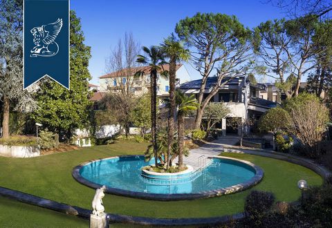 Elegant and very charming villa for sale on the outskirts of Milan, surrounded by a stunning 3,000-sqm garden with a swimming pool. This recently-built property measures 650 sqm and has four floors. Great care has been given to the choice of material...