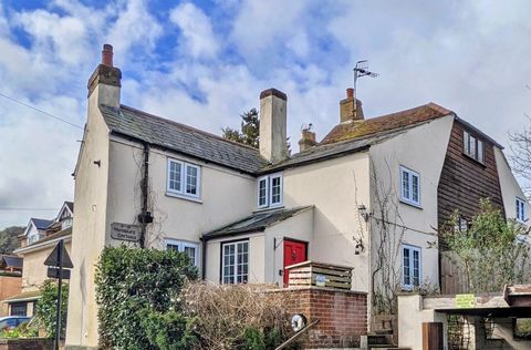 Steeped in history, this charming property was once a pair of dairy cottages built in 1700, but in more recent times it was converted into a detached country house in an elevated position offering wonderful views. It is now a characterful family home...
