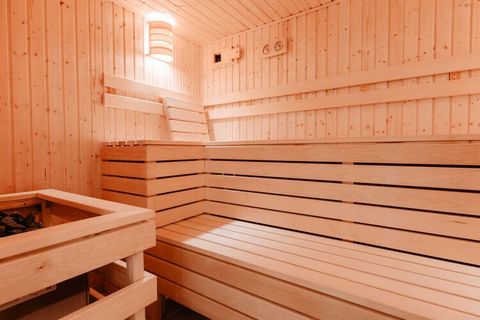 Stylish accommodation for up to 35 people with sauna, balcony and mountain views. Ideal for friends, families and groups!