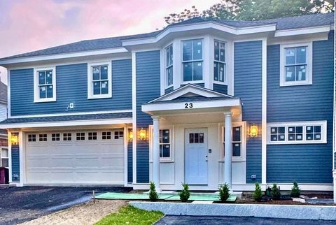 New construction in premier Newton Centre, this spectacular townhouse lives like a single-family with a sprawling layout and timeless design. Minutes from shops, dining, and houses of worship, the main level offers a two-car attached garage, powder r...