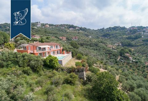 This staggering luxury villa with a panoramic swimming pool is up for sale and situated a short distance from Imperia. This modern property is distributed over two floors, has been recently-built , while adding sophisticated finishes and its total in...