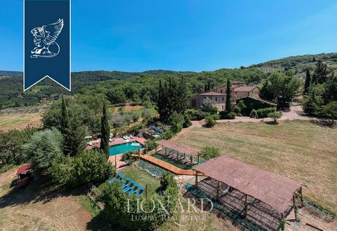 Overlooking the historical Vignamaggio valley, in the heart of Chianti, there is this charming Tuscan farmstead for sale among expanses of vineyards and olive groves. Six hectares of grounds embrace the property in an authentic natural oasis of peace...