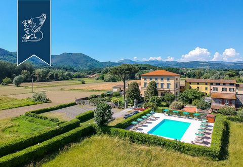 This wonderful 18th-century villa surrounded by the Tuscan countryside is for sale near Lucca. A spacious, high-end driveway gives access to this enchanting property and to the park surrounding it, which measures 9,500 sqm. The villa is on three floo...