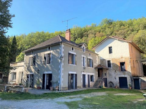 Former mill with its water rights and house dating from the early 20th century with outbuildings set in over 7 ha of land, in the leafy, wooded setting of a small valley.A rarity in its field: this mill has all its original features in very good cond...